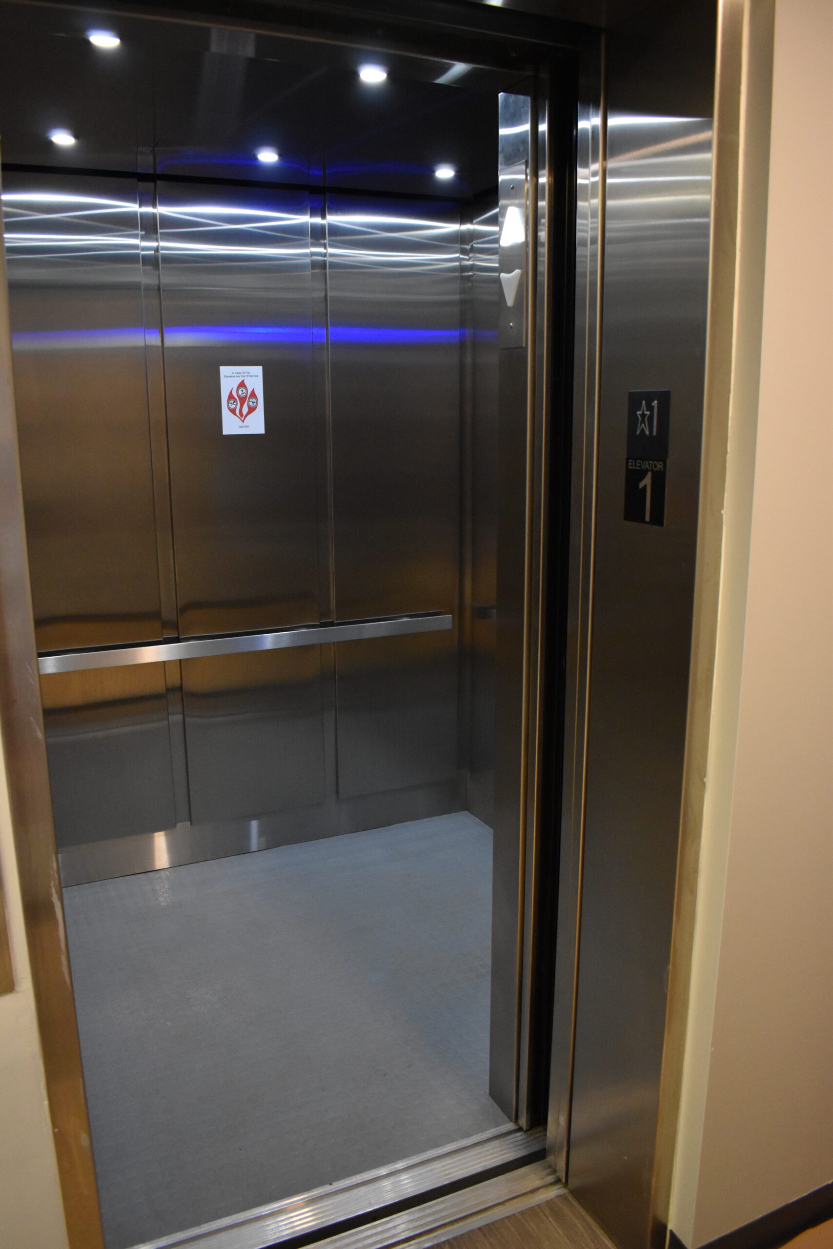 a stainless steel elevator in a building