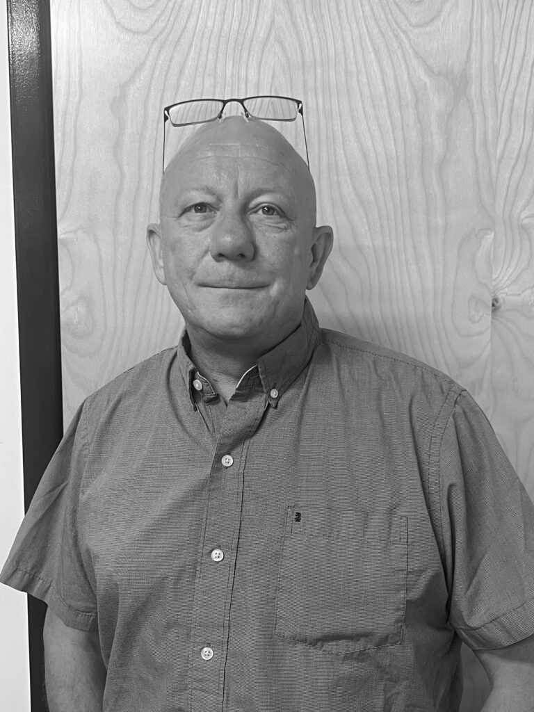 a black and white photo of a man with a bald head