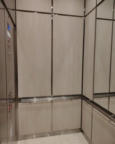 a bathroom with a toilet and a shower stall