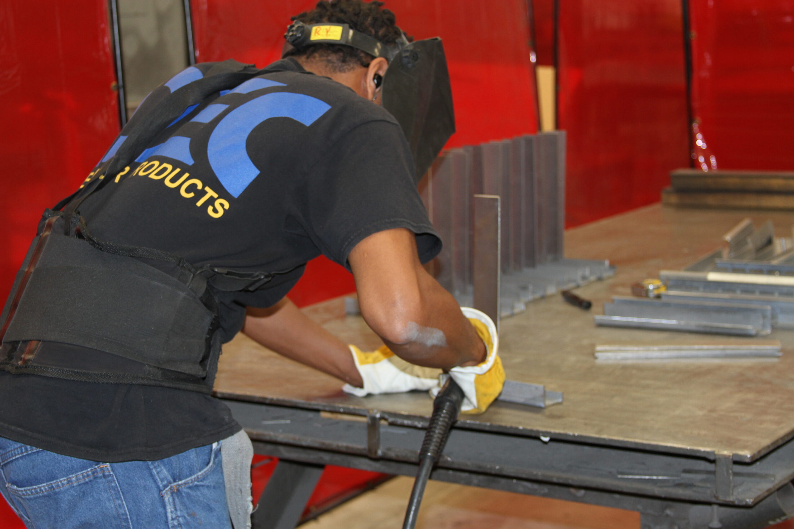 a man sanding a table with a machine