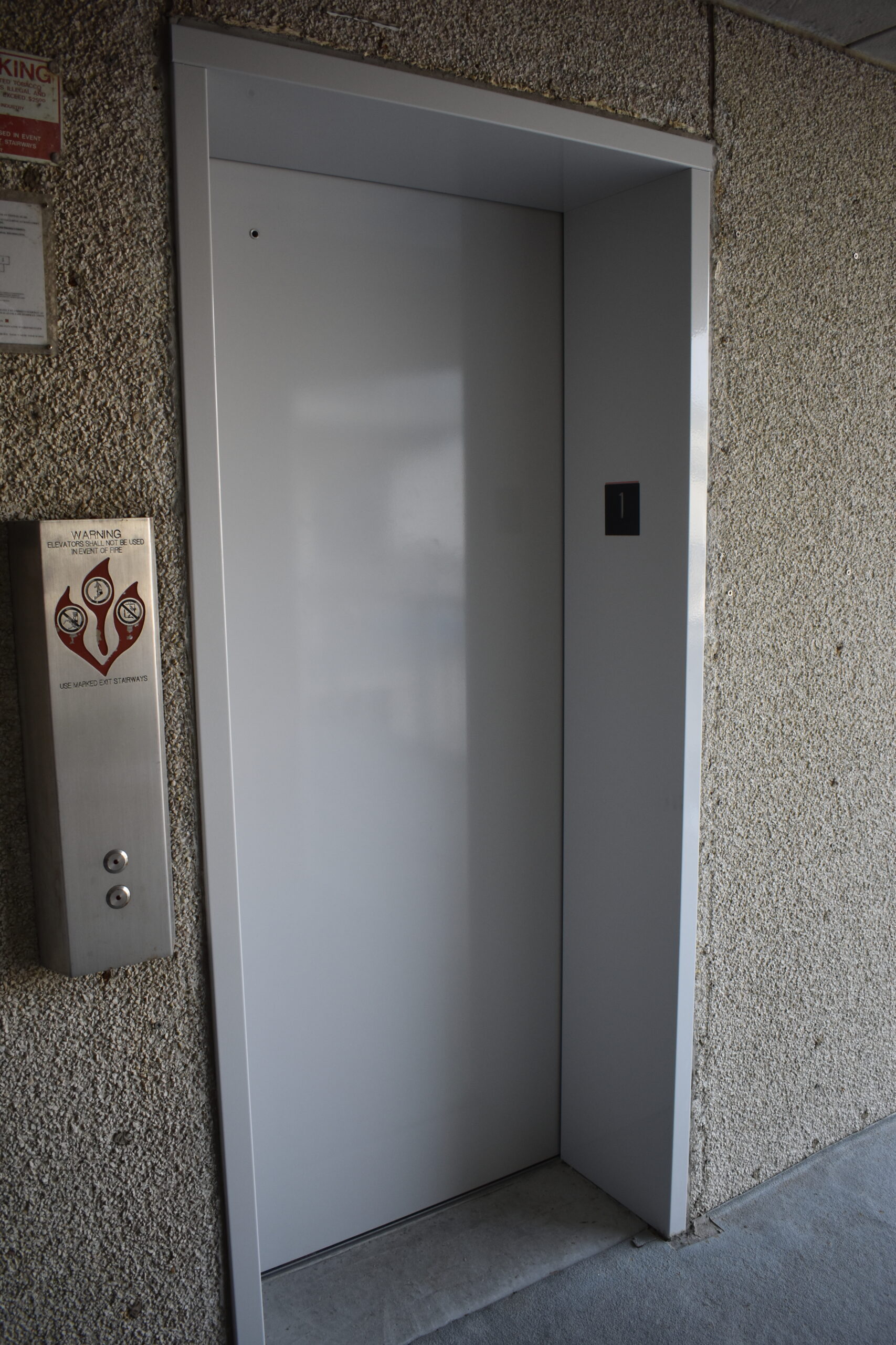 an open door to a room with a sign on the wall