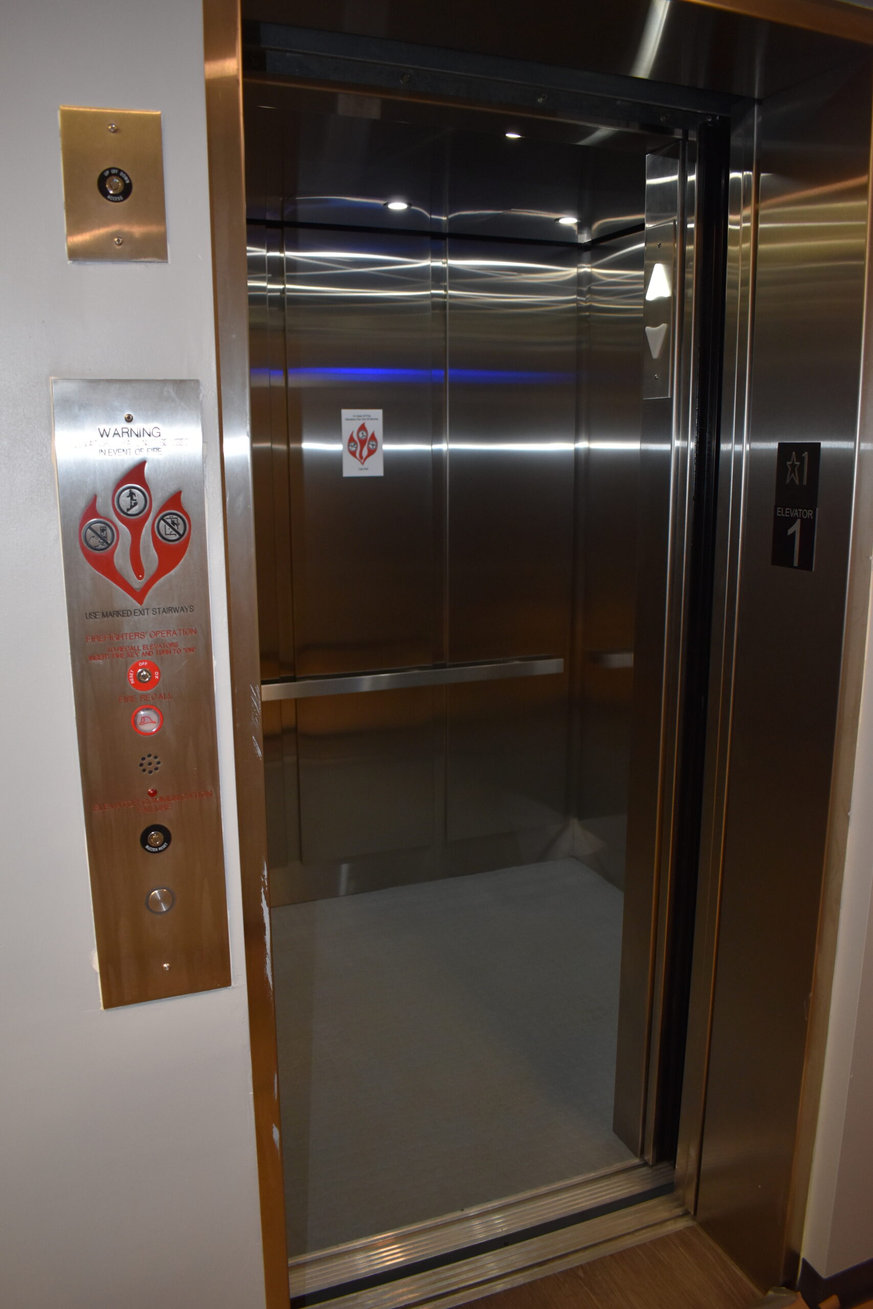a stainless steel elevator in a building