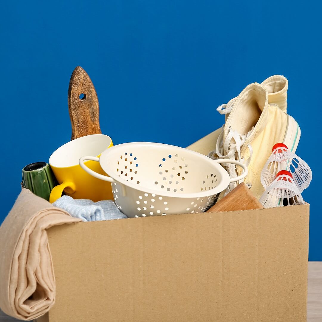 cardboard box of donated essential items