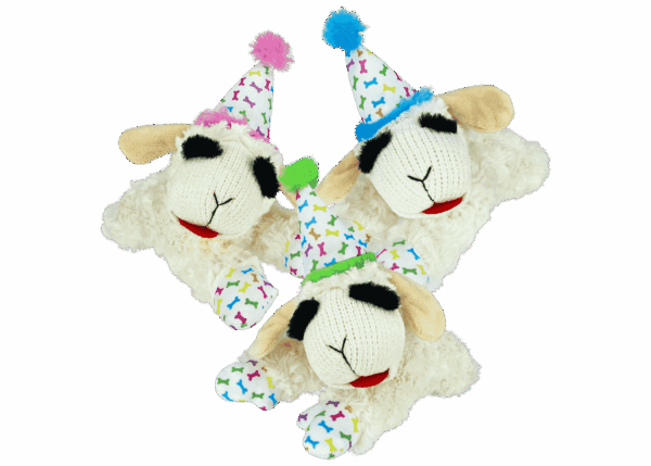 two stuffed sheep wearing party hats on a green background