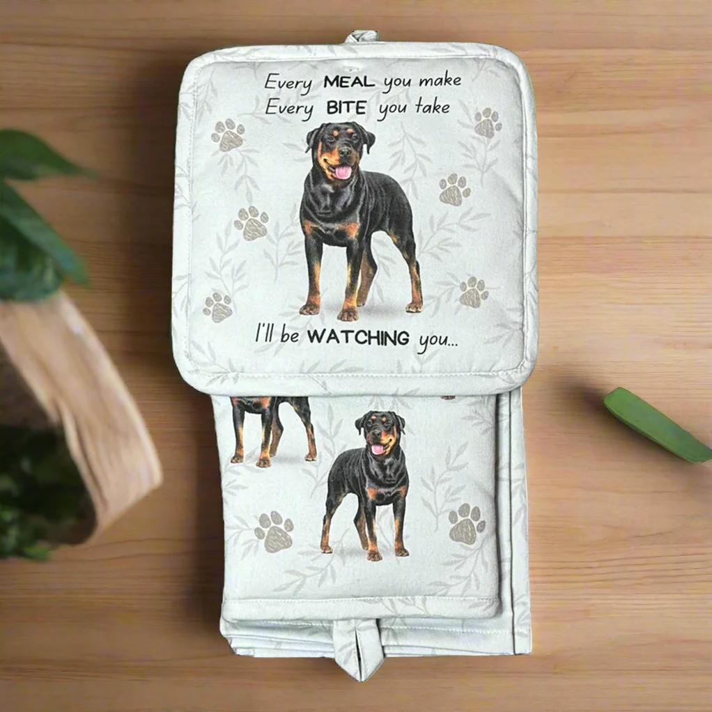 a black and brown dog sitting on top of a wooden table