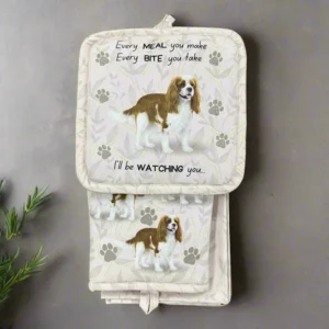 a set of two oven mitts with dogs on them