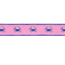 a pink ribbon with blue crabs on it