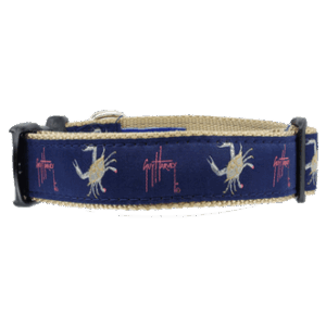 a blue dog collar with white crabs on it