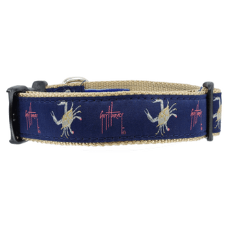 a blue dog collar with white crabs on it
