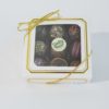 box of 9 piece Gourmet Truffles decorated with gold ribbon