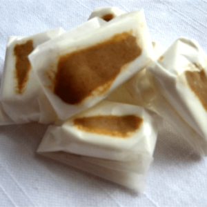 stack of wrapped Peanut Butter Nougats