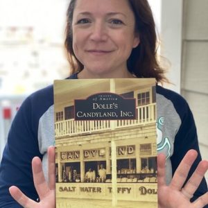woman holding Images of America: Dolle's Candyland, Inc Book