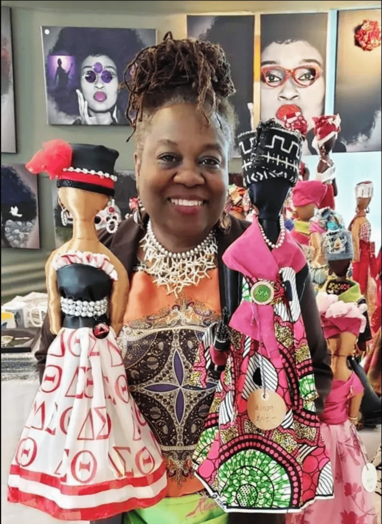 woman with crafted dolls