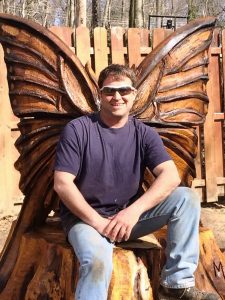 Image depicts carving artist funded through a DCA CAD grant