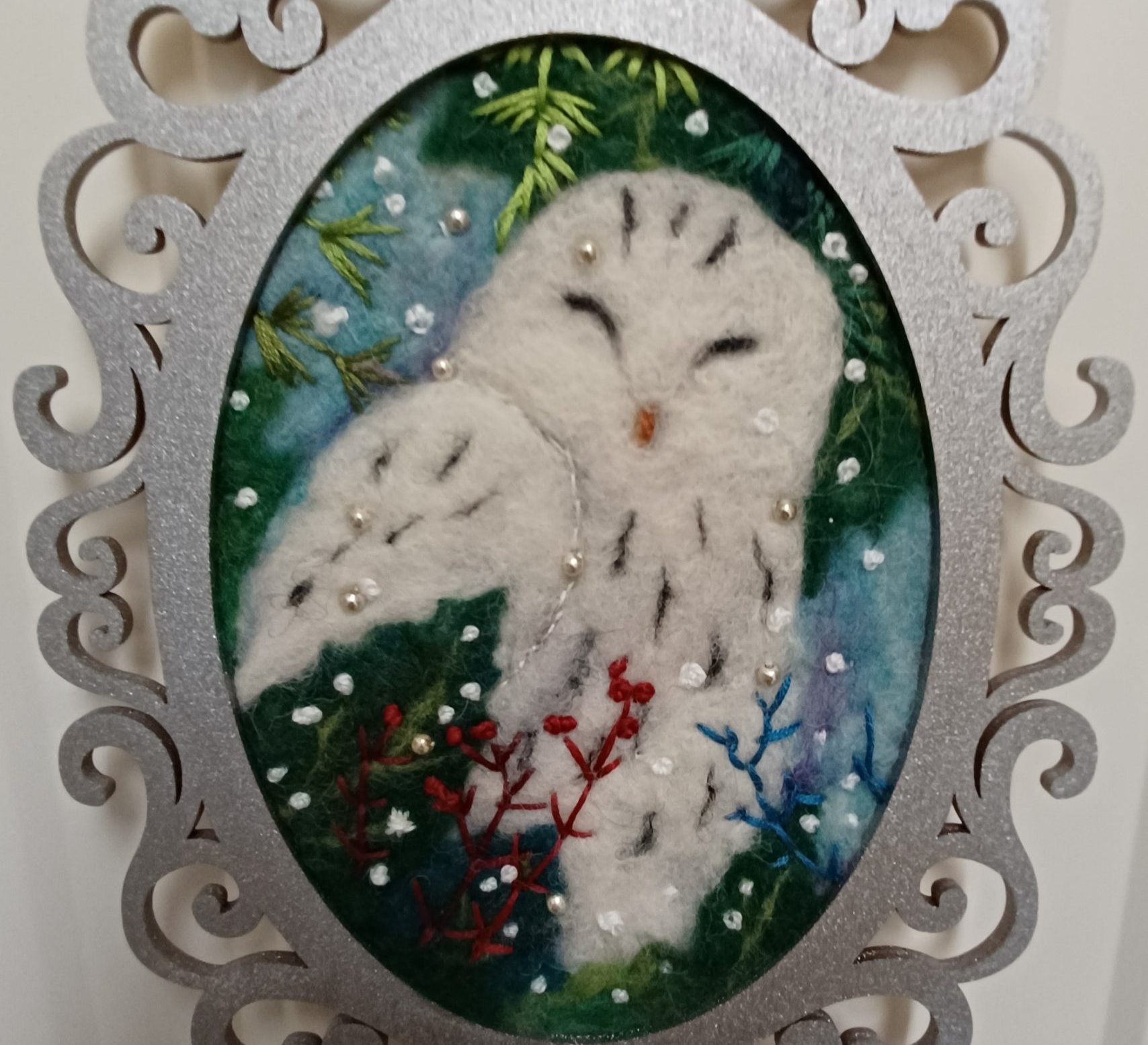 Snowy owl in needle felt and embroidery, 5 in x 7 in oval
