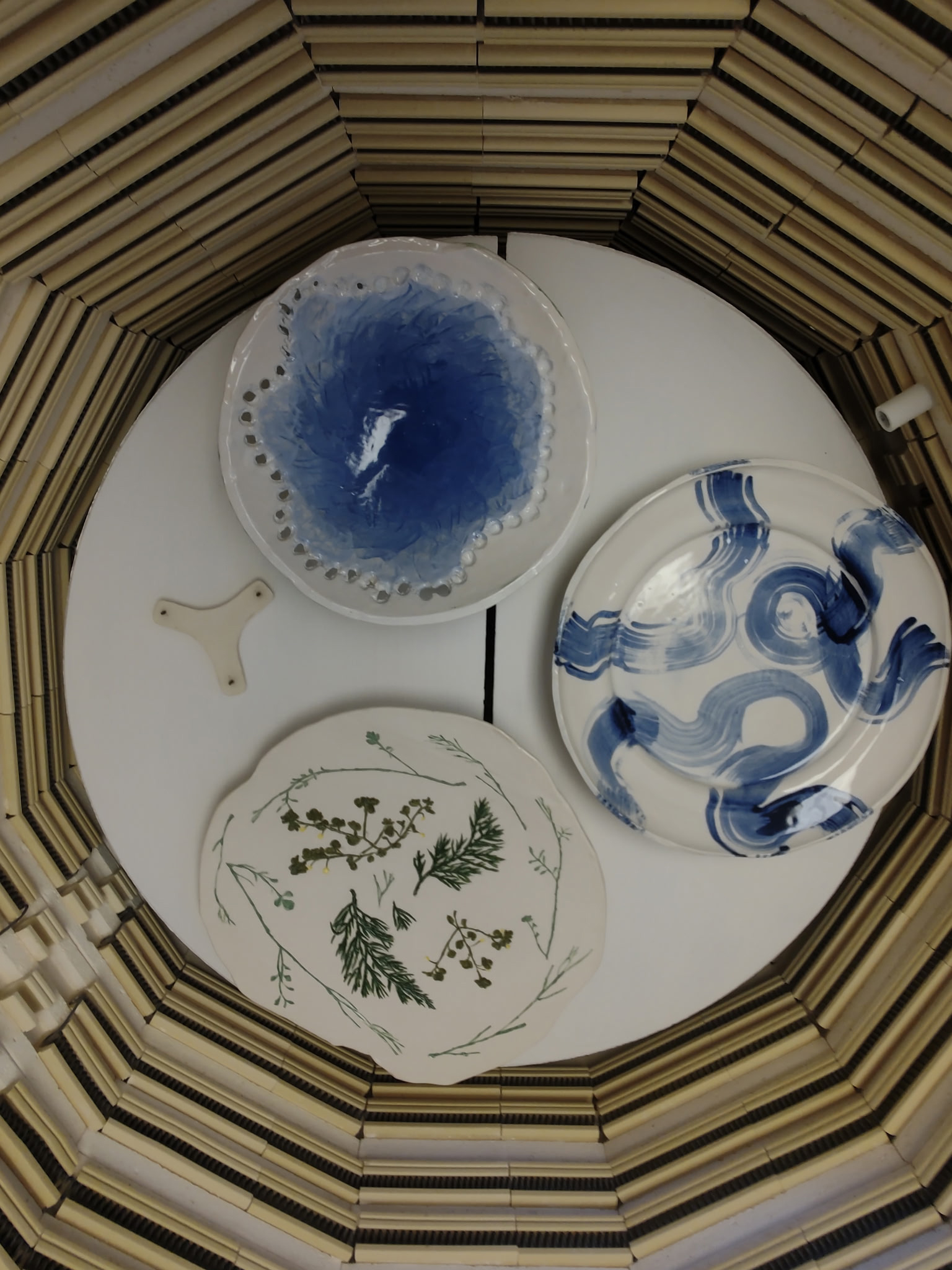 3 pottery dishes in a basket