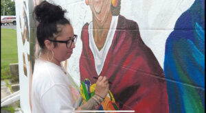 Local artist working on new mural in Cambridge.