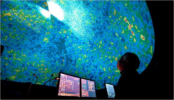 Man stares at image on a big screen