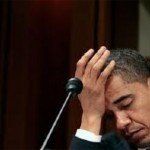 Obama appears defeated with hand to forehead