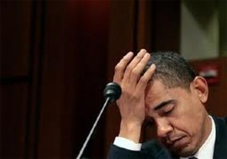 Obama appears defeated with hand to forehead