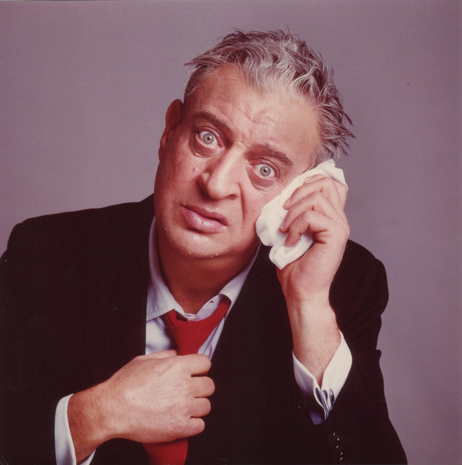 The late Rodney Dangerfield with confused look on face