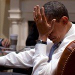 Obama palms his face under stress