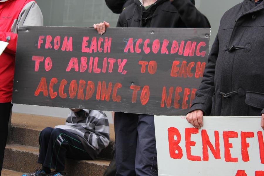 Sign reads From each according to ability, to each according to need