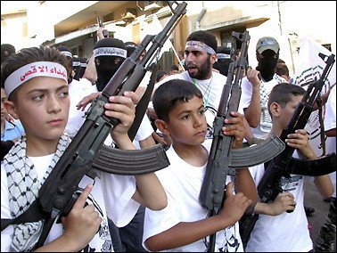 Young kids hold rifles in unision