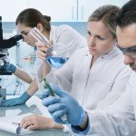 Group of scientists in a laboratory doing various experiments