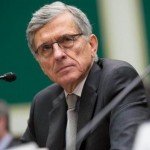 Tom Wheeler at speaking event with blank facial expression