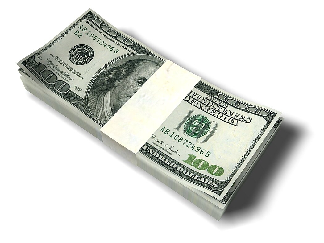 A stack of 100-dollar bills on white background