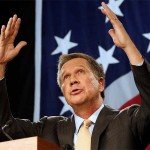 John Kasich holds hands up during speech