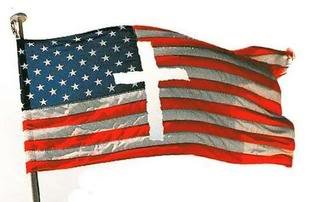The American flag with a religious cross in the center