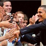 Obama shakes hands and poses for pictures