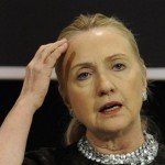 Hillary Clinton scratches head with dumbfounded look on face