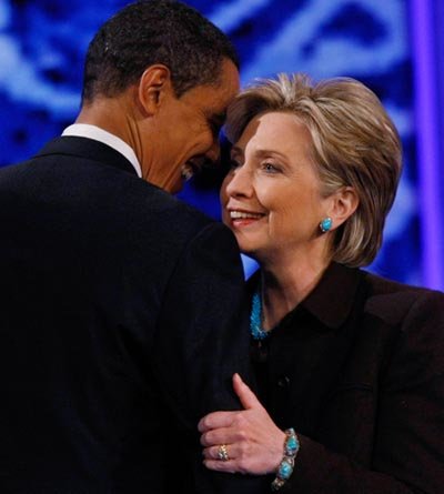 President Obama and Hillary Clinton embrace and smile