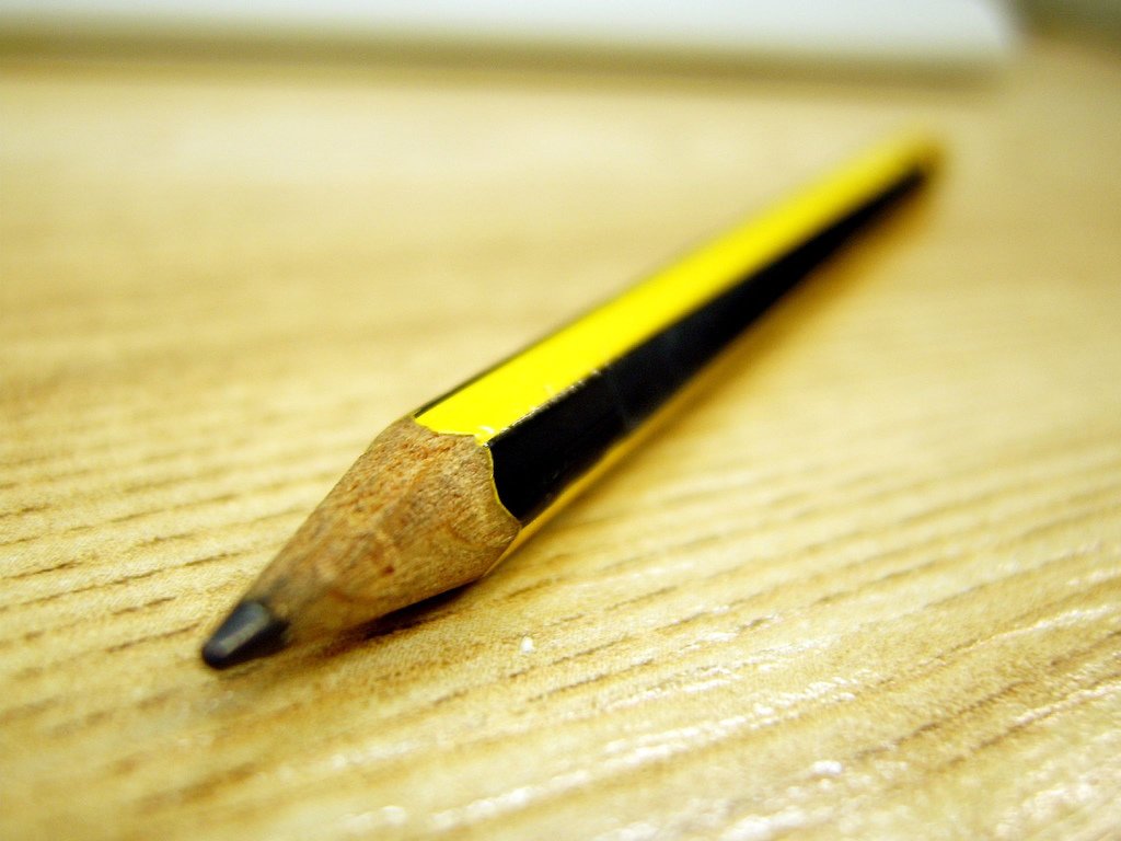 Closeup of a pencil point on a wooden table