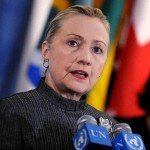 Hillary Clinton with hair pulled back giving speech