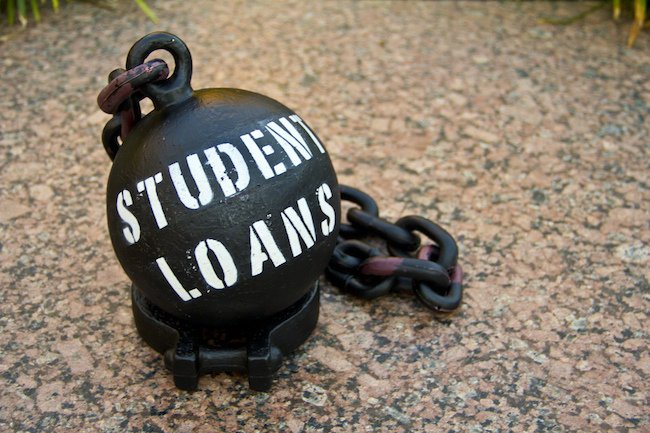A black ball with black chains that read Student Loans in white letters