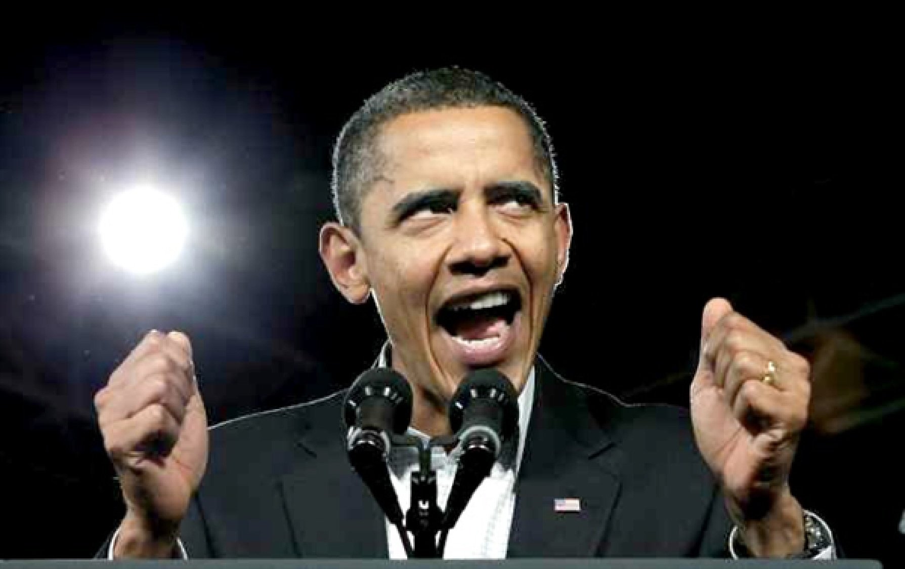 Obama gives a speech with enthusiasm as bright lights shine in background