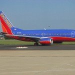 Southwest Airlines red and blue airplane sitting at airport runway