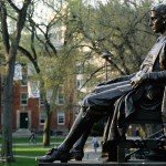 Side view of John Harvard statue