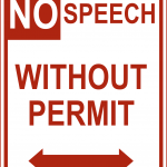 Red and white road sign reads No Speech Without Permit