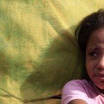 Young girl with tears streaming down her cheeks
