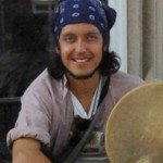 Alexander Ciccolo sitting on doorstep with reflection in background