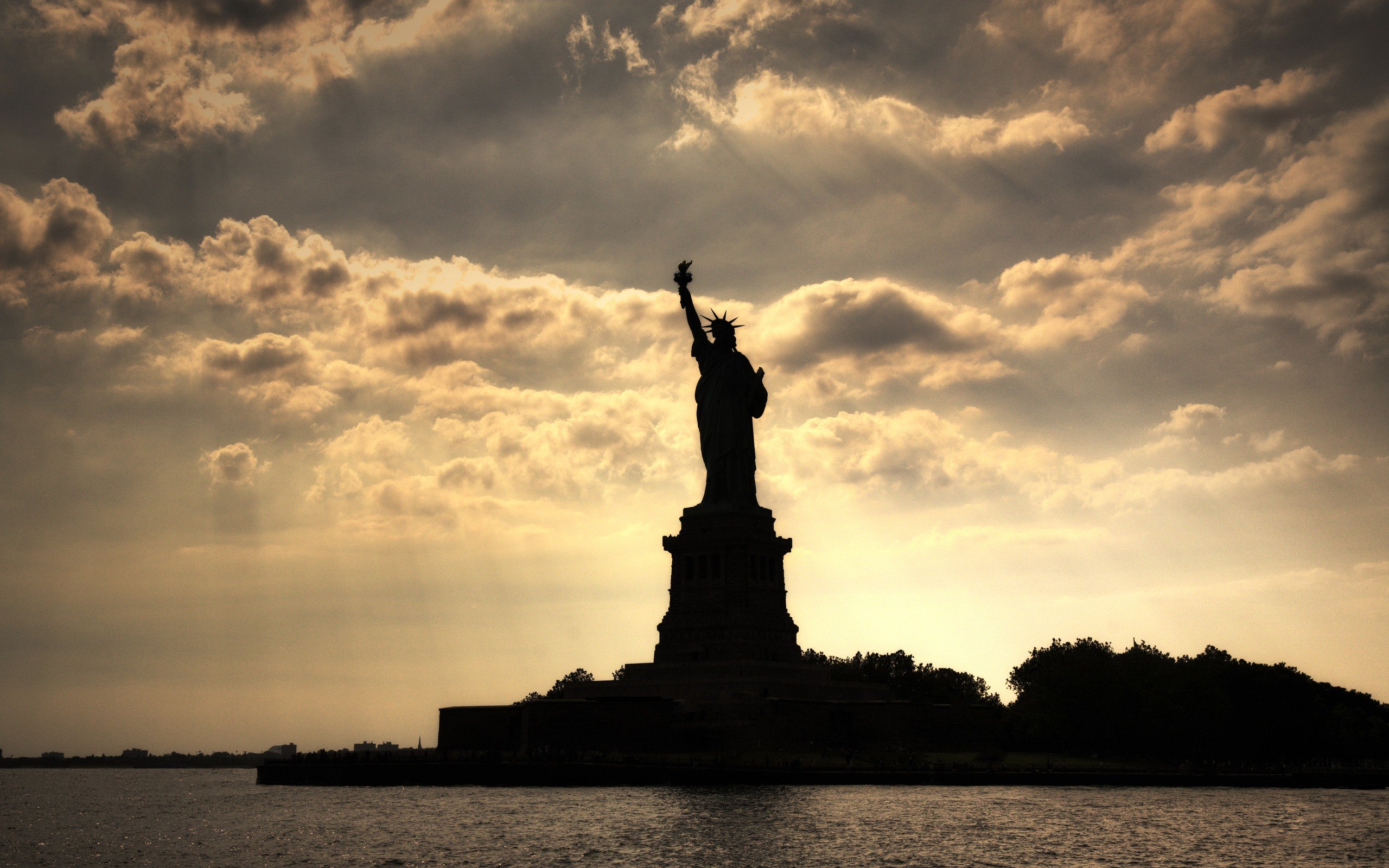 Statue of Liberty with clouds in the background