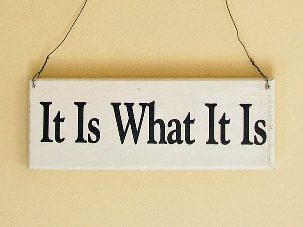 Wall hanging reads It Is What It Is
