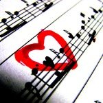 Sheet music with a red heart drawn over music notes
