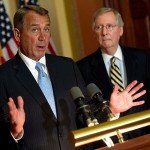 John Boehner speaks with Mitch McConnell in background