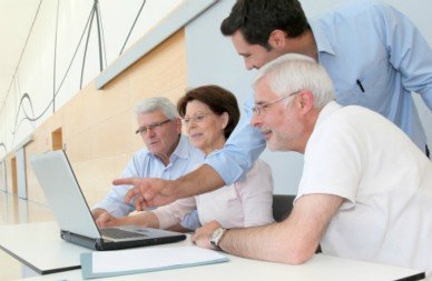 Young man presents to older individuals